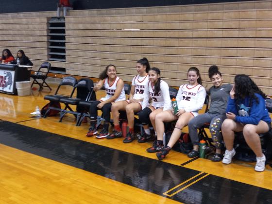 Starters Vanessa Diaz (23), Malyana Stephenson (20), Alyssa Milano (3), and Karli Cole (12) relax on bench after staking Gateway to a 65-29 lead in three quarters.  The big lead allowed coach Justin Marino to rest the starters for the entire fourth quarter. PHOTO/DAN PEARSON