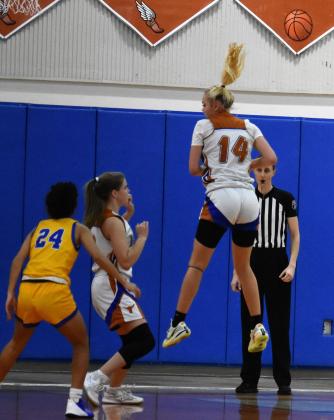 Harmony's Faith Wener goes up for a rebound  in Friday's 43-37 District 7A-5 championship game win over Osceola. PHOTO/KATIE WILLIAMS