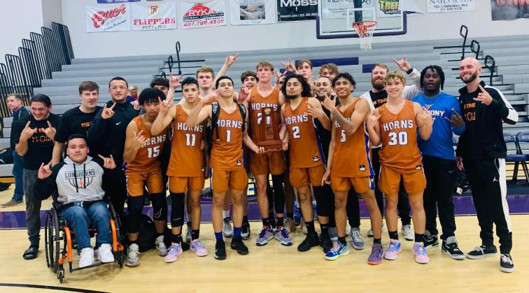 The Harmony Longhorns -- for the first time, the district boys basketball champions. PHOTO/KATIE WILLIAMS