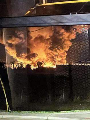 A fire at a nursery on Avenue A north of Poinciana High School burned through the early morning and daybreak hours. PHOTO/ALEXIS ELWICK