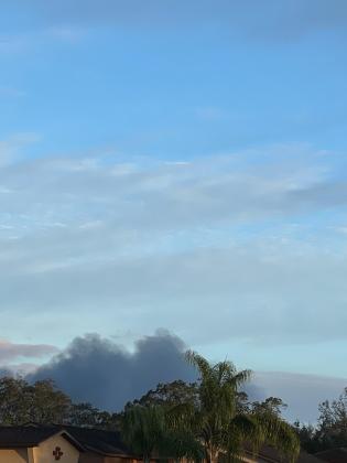 The view of smoke from the fire from a home near Ham Brown Road and Reeves Road, about 3 miles south of the fire around 7:15 a.m. PHOTO/JAMIE KARWOWSKI
