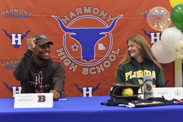 Harmony High's Tyler Emans (football) and Amanda Whalen (softball) sign scholarships to Brown University and Florida Gateway University on Wednesday. PHOTO/KATIE WILLIAMS