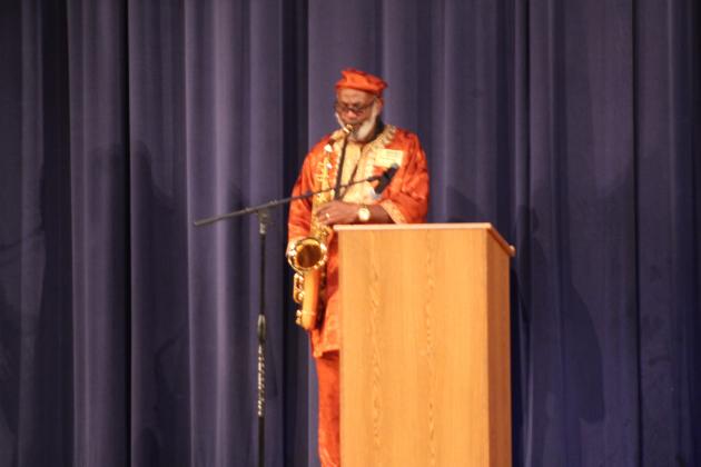 Clifford Youngblood, a classmate of Charles Martin, the first black graduate of Osceola High School, provides a Monday morning serenade, Sam Cook's "There's a Change Comin'", at a memorial and monument dedication.PHOTO/KEN JACKSON