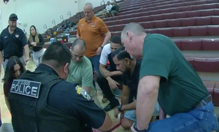 Quick thinking and acting by first responders, including a School Resource Officer, saved the life of a St. Cloud Middle School basketball coach Tuesday night. PHOTO VIA ST. CLOUD POLICE VIDEO
