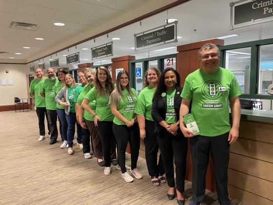 Osceola Clerk of Court Kelvin Soto (at right) and his staff stand ready to assist Osceola residents with unpaid fees save money through Operation Green Light starting Saturday.