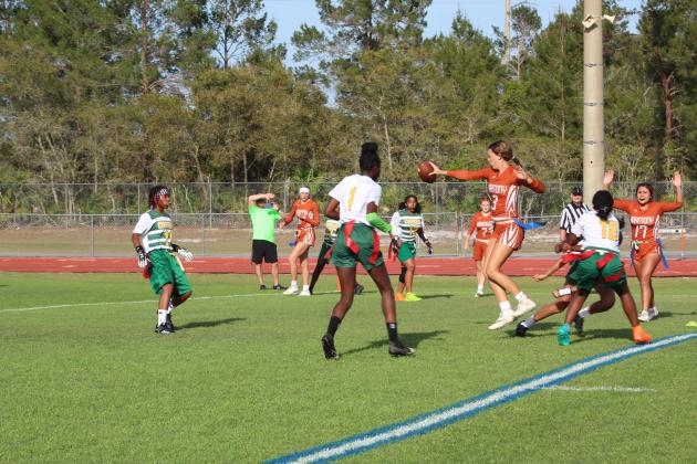 Harmony quarterback Martha Edwards threw for three touchdowns and ran for two more, like this one in the Longhorns' 33-6 Orange Belt Conference flag football championship game. PHOTO/KEN JACKSON