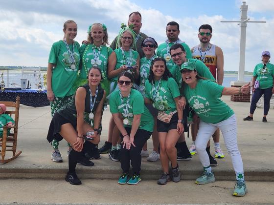 Some of the "spirited" participants at March for Meals from the Osceola County Sheriff's Office, with Osceola Council on Aging Senior Vice President for Nutrition Wilda Belisle. PHOTO/KEN JACKSON