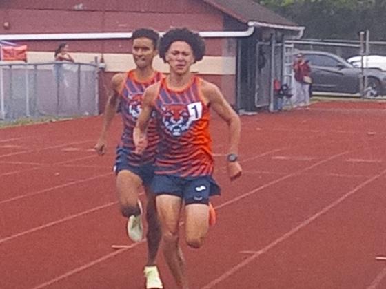 Tohopekaliga’s Johan Comacho (front) outduels teammate Zeniel Lizardo to capture the 1,600 meter run at Wednesday's Orange Belt Conference track meet. PHOTO/DAN PEARSON