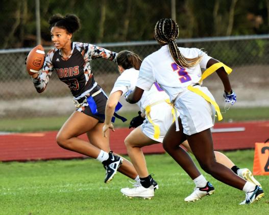 Ella Husbands runs for yardage in Thursday's 27-0 win over Horizon to claim another district championship. PHOTO/KATIE WHITT WILLIAMS