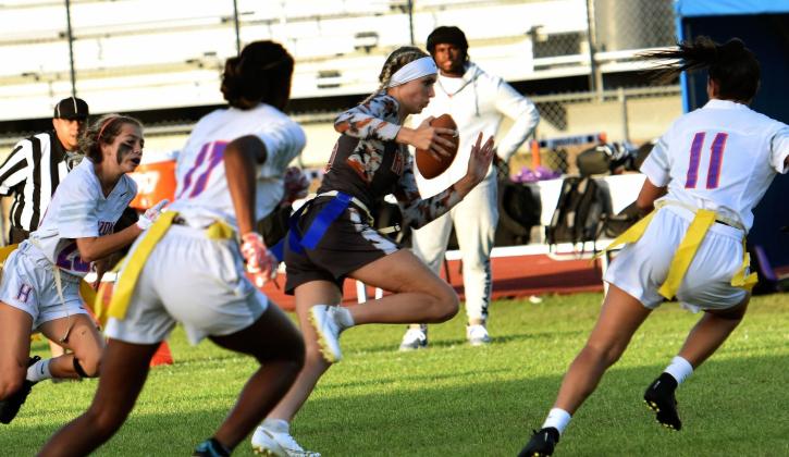 Drea Thompson returns an interception in Thursday's flag football District 2A-9 title game. PHOTO/KATIE WHITT WILLIAMS