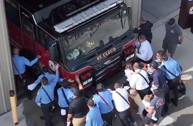 St. Cloud Fire Rescue and City of St. Cloud officials help "push back" new Engine 33 during Friday's ceremony at the fire station on Friars Cove Lane. PHOTO/CITY OF ST. CLOUD