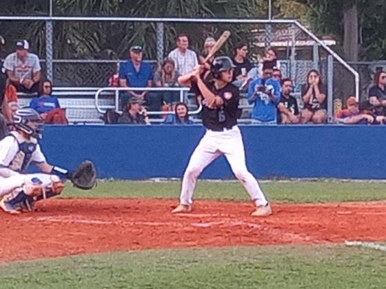 Harmony’s Hunter Bola steps into the batter’s box against Osceola. Bola reached on an RBI single on the play – one of nine runs the Longhorns would plate in the fourth inning of a 12-9 win. PHOTO/J. DANIEL PEARSON