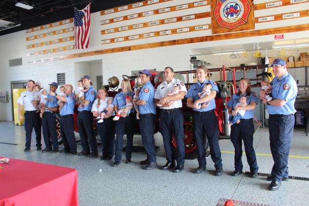 Babies, babies everywhere! Thirteen Kissimmee Fire Department employees or their spouses or partners gave birth, for most their first children, in the last 11 months. KFD held a happy gathering Thursday to celebrate the responder baby boom. PHOTO/KEN JACKSON