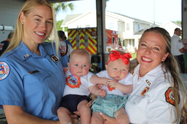 Stevie White-Mckinnon (left baby) and Easton Waldrun were born a week apart in December to EMT Kailey White and Fire Inspector Jillian Waldrum. PHOTO/KEN JACKSON