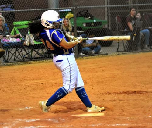 Osceola's Gabriela Avila swings at a pitch in Friday's 8-3 OBC championship win.  PHOTO/KATIE WHITT WILLIAMS