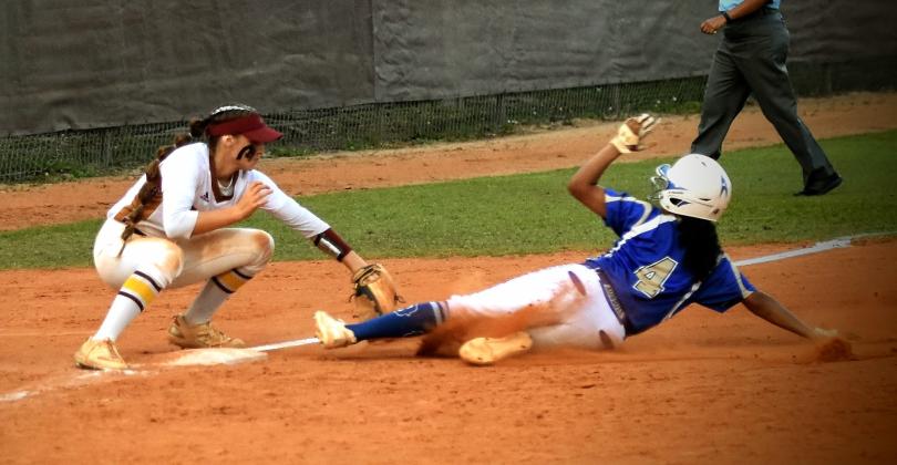 Nayeli Hernandez slides into third during Friday's OBC championship game. PHOTO/KATIE WHITT WILLIAMS
