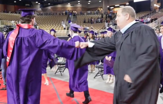 Celebration High Principal Conner Gilbert congratulations a Class of '23 grad. PHOTO/OSCEOLA COUNTY SCHOOL DISTRICT