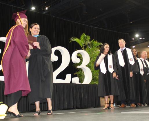 Deferring diplomas, St. Cloud High style. PHOTO/KEN JACKSON