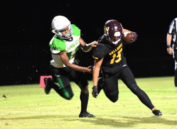 St. Cloud's Owen Conner fights for yardage in Friday's Kickoff Classic against Haines City. PHOTO/KATIE WILLIAMS