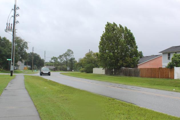 Wind and rain affecting the area, but people are out and about as usual. PHOTO/KEN JACKSON