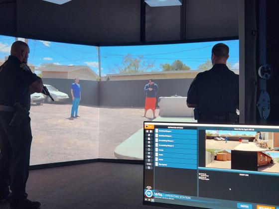 St. Cloud Police officers work through live scenario training Friday on the VirTra training simulator. PHOTO/KEN JACKSON