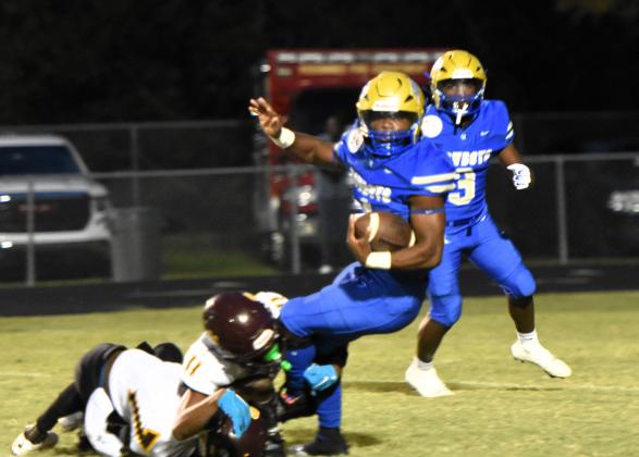 The St. Cloud defense slowed down Osceola's Taevion Swint at times, but not enough -- he scored four touchdowns in Friday's 49-3 win in "The Game". PHOTO/KATIE WILLIAMS
