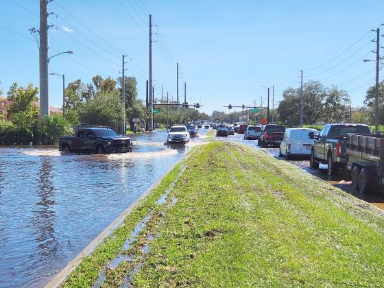 Hoagland Avenue just north of John Young Parkway on Sept. 30. Osceola County would close the road minutes after this photo was taken. PHOTO/KEN JACKSON