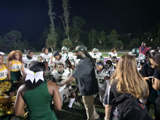 Charger players celebrate their first win in 22-months after Thursday’s 20-17 win over Celebration. It was also the first win as head coach for Dee Hart, who took over the Liberty program last spring. PHOTO/DAN PEARSON