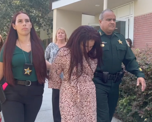 Susana Tamayo-Viera was led to jail Monday on charges that she sexually battered a teenager. OSCEOLA COUNTY SHERIFF'S OFFICE