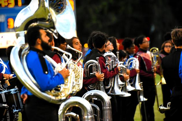 The two school’s marching bands formed one sound in playing the National Anthem before Friday's 100th Osceola-St. Cloud game.