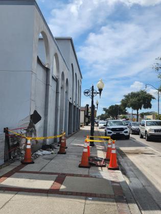 By Monday, the crash site at the CenturyLink building was confined to the sidewalk. PHOTO/KEN JACKSON