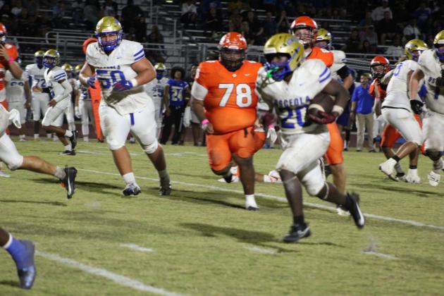 Osceola running back Elijah Hickson runs for a chunk of his 125 yards in Friday's 38-0 District 4S-10 clinching win over Tohopekaliga. PHOTO/KEN JACKSON