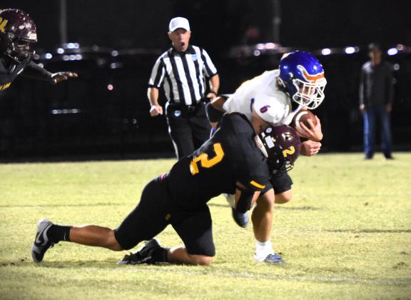 St. Cloud linebacker Landon Millman drags down Harmony quarterback Kal Amen during the Bulldog's dominant performance in Friday's 21-0 Soldier City Classic win. PHOTO/KATIE WILLIAMS