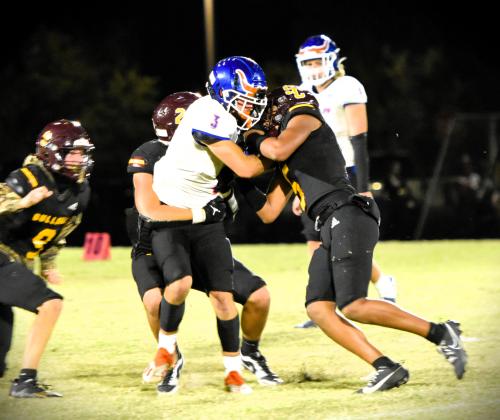 More dominant defense from the Bulldogs as Millan and Bryce Williams wrangle Wade Kempfer. PHOTO/KATIE WILLIAMS