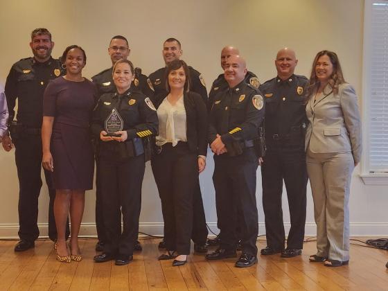 The Kissimmee Police Department received Help Now of Osceola County’s Citrine Gem Award of Safety for its efforts to assure the safety of those who have already faced domestic violence.  PHOTO/KEN JACKSON