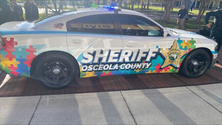Tuesday, the Osceola County Sheriff’s Office unveiled a special cruiser wrap that it is touting as its autism awareness cruiser vehicle. SUBMITTED PHOTO