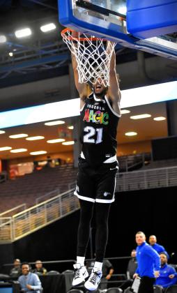 The Osceola Magic's Trevelin Queen dunks for two of his team-high 30 points during Wednesday's matinee game, a 116-114 loss to the Birmingham Squadron. PHOTO/KATIE WILLIAMS