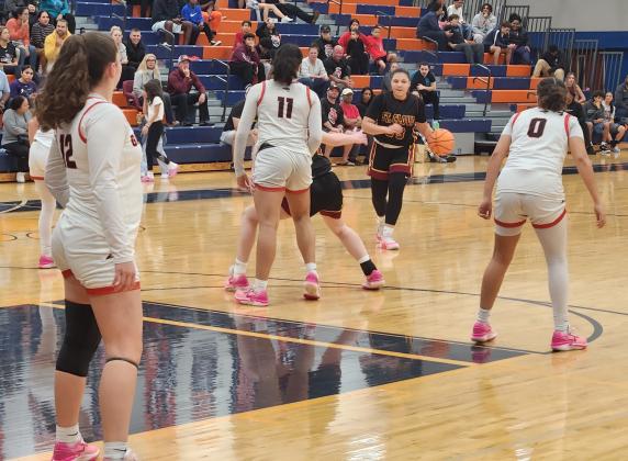 St. Cloud's Danzigny Mantilla (23) surveys the Gateway defense during Friday's Orange Belt Conference girls basketball championship. PHOTO/KEN JACKSON