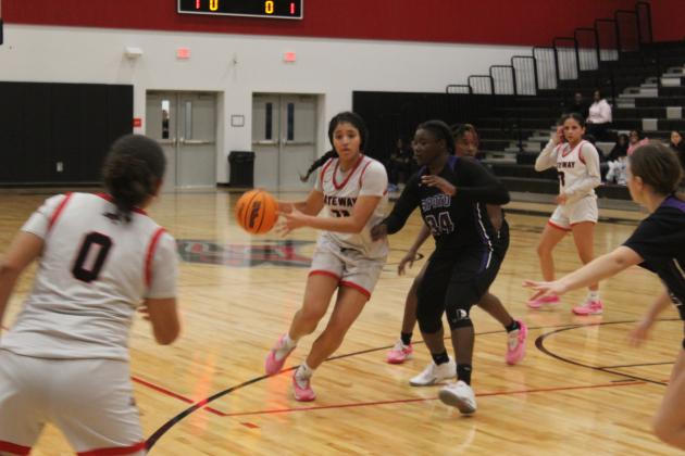 Gateway's Evana Rivera drives in against Spoto's Clinnesha Simmons in Wednesday's Class 5A regional playoff game. PHOTO/KEN JACKSON