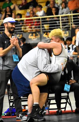 McCallister shared an emotional embrace with Harmony Coach Vic Lorenzano -- that knocked him off his feet -- after the match. PHOTO/KATIE WILLIAMS