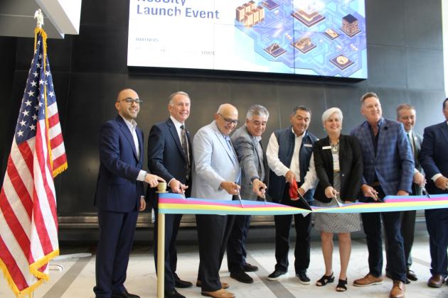 Local officials cut a ceremonial ribbon Thursday to welcome Plug and Play -- and they got to work right away at NeoCity. PHOTO/TERRY LLOYD