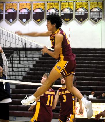He's levitating: St. Cloud's Enrique Soto goes up high to put down a hit in the Bulldogs' five-set regional playoff win Tuesday over Dr. Phillips. PHOTO/KATIE WILLIAMS