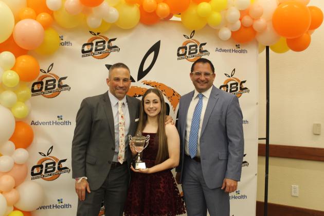 Girls Athlete of the Year Ashley Aun, with her coach — and dad — Corey Aun and Osceola School Superintendent Dr. Mark Shanoff. PHOTO/KEN JACKSON