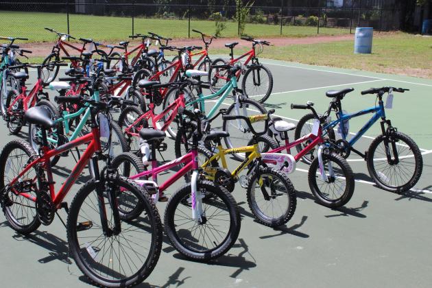The bikes were a donation from Waste Management; city Parks &amp; Recreation officials identified the recipients. PHOTO/KEN JACKSON