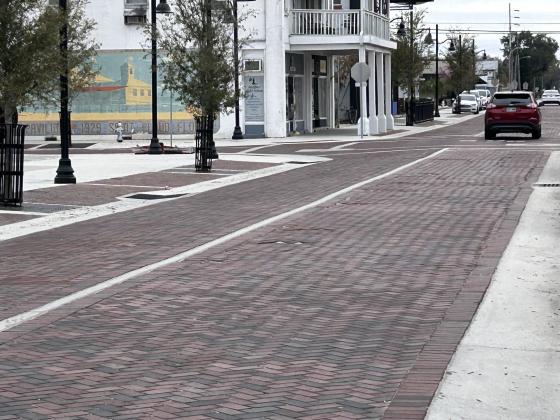 Potholes and the sand sublayer are present in the brick work done in downtown St. Cloud; the city and contractor have mediated a settlement to get the problems fixed once and for all. PHOTO/THOMAS OUELLETTE