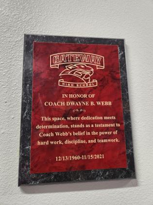 A plaque on the outside of Gateway High's new gym honors former coach Dwayne Webb, who passed away in 2021 after a battle with colon cancer. PHOTO/KEN JACKSON