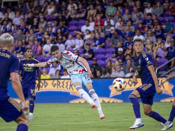 Rodrigo Schlegel (right) defends against the Chicago Fire. PHOTO/MARIO CASAMALHUAPA