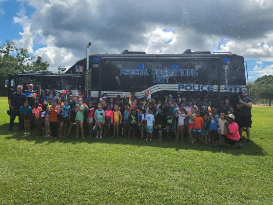 The kids from the Hopkins Park summer camp program were excited about another water and balloon fight win against the St. Cloud Police Friday. PHOTO/KEN JACKSON