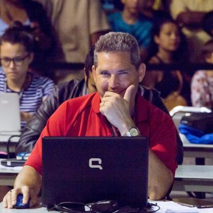 Ken Jackson, then a reporter, working feverishly hard — until spotted by photographer Rob Herbert — at the Hillary Clinton rally at Osceola Heritage Park during the 2016 election. Note the red shirt at a "blue" rally. FILE PHOTO