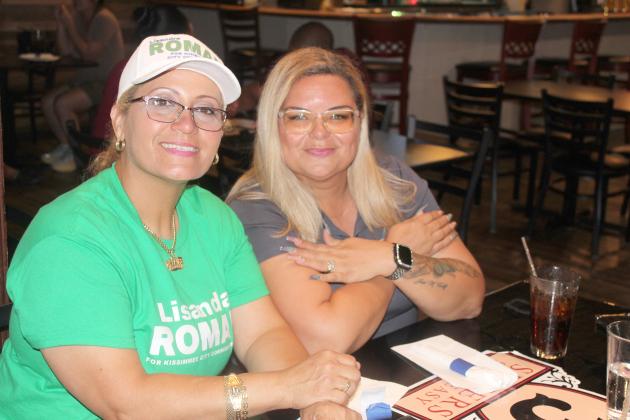PHOTO/KEN JACKSON Lisandra Roman (left) with Kissimmee Commissioner and friend Janette Martinez, is all smiles after earning a spot in the Nov. 5 general election against Noel Ortiz for City Commission Seat 1.